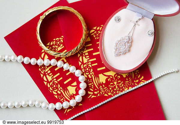 Close-up of Bridal Jewelry and Ang Pow  Studio Shot