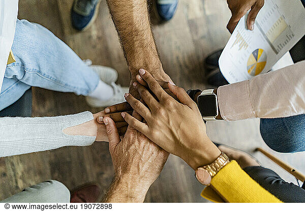 Close-up of business team stacking hands