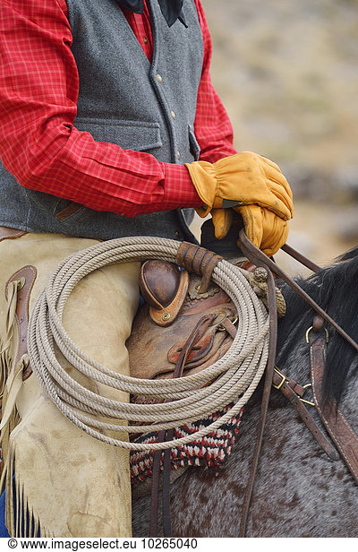 Close-up of Cowboy Sitting on Horse  Rocky Mountains  Wyoming  USA