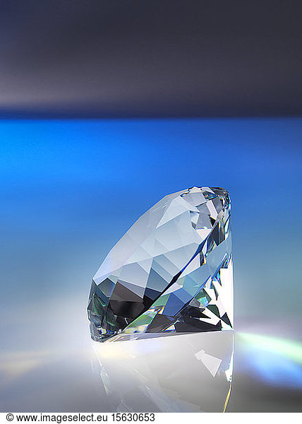Close-up of diamond on table against black background