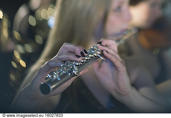 Close up of flutist performing