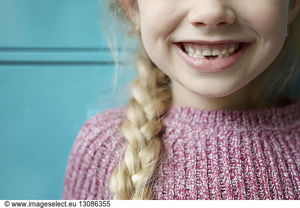 Close-up of girl showing missing teeth