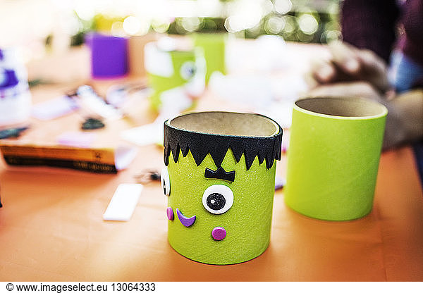Close-up of green decorations at table during Halloween party