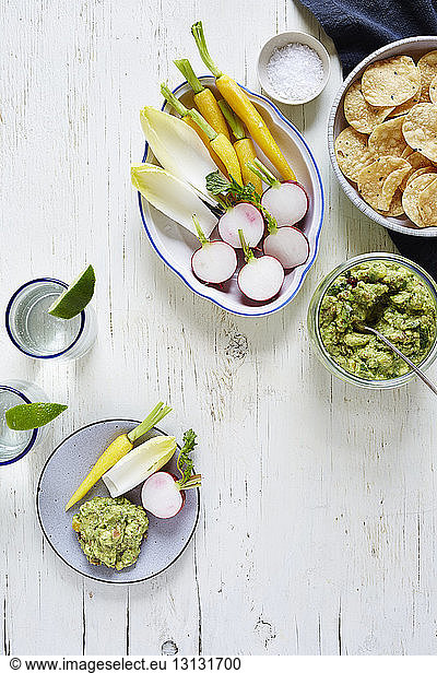 Close-up of guacamole and vegetables on table