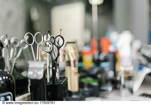 Close-up of haircutting scissors on table in salon
