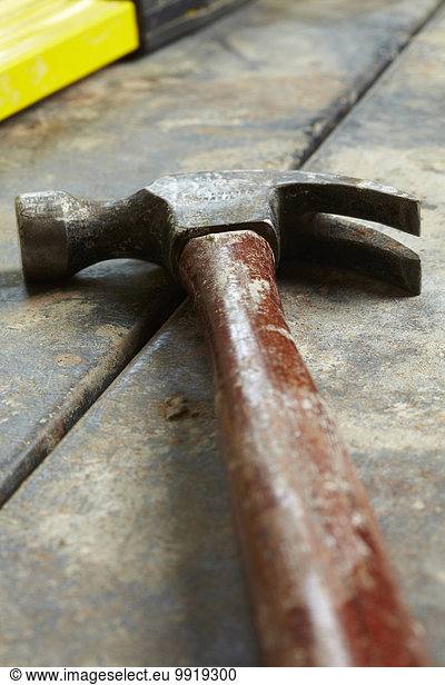 Close-up of Hammer on Wooden Floor