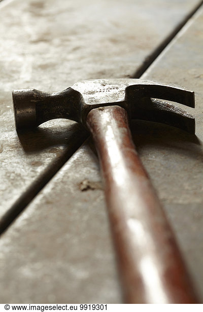 Close-up of Hammer on Wooden Floor