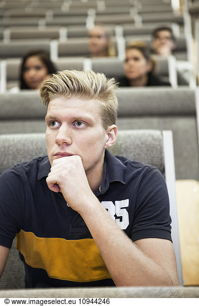 Close up of handsome young man concentrating on seminar