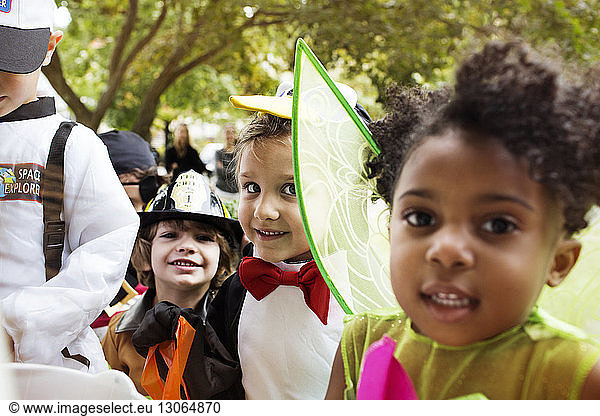 Close-up of happy children in Halloween costumes