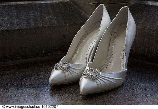 Close up of high heeled wedding shoes.