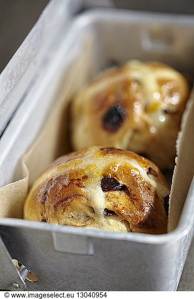 Close-up of hot cross buns in container