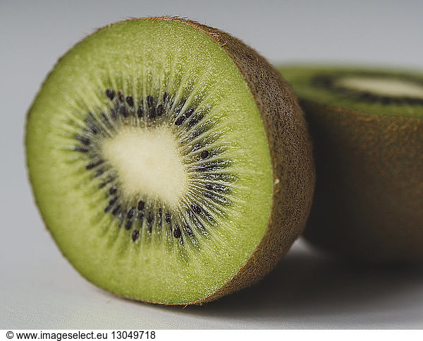 Close-up of kiwi slices on white background