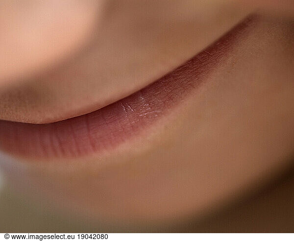 Close up of lips smiling.