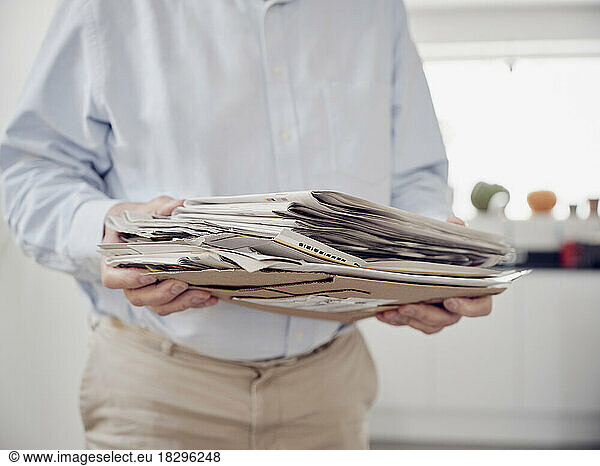 Close up of man holding waste paper