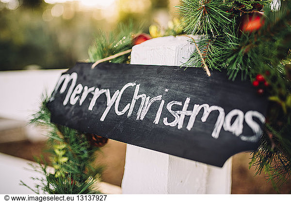 Close-up of Merry Christmas text on blackboard