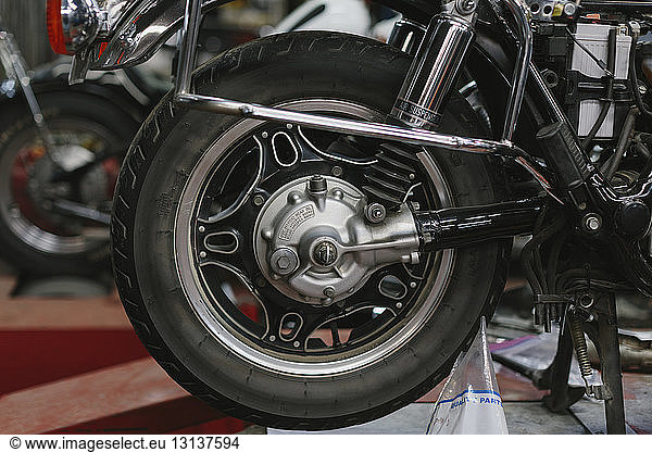 Close-up of motorcycle tire in auto repair shop