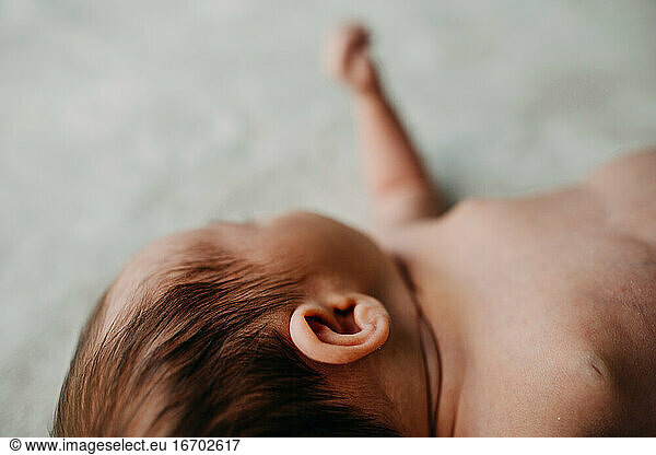 Close up of newborn baby ear and hair details