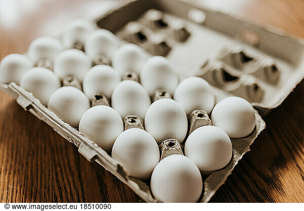 Close up of open carton of fresh store bought white eggs