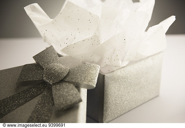 Close up of opened gift with tissue paper