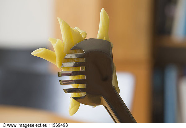 Close-up of pasta with spatula