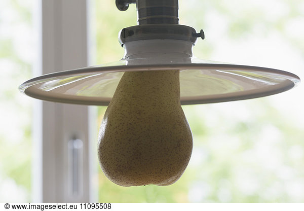 Close-up of pendant light with pear