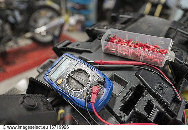 Close-up of polymeter in motorcycle customization garage