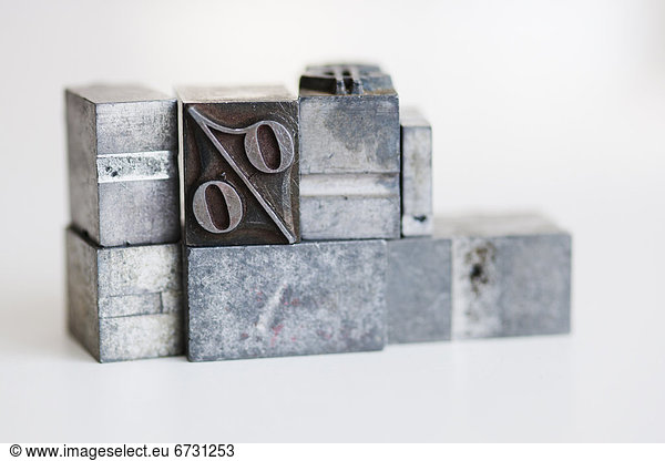 Close up of printing blocks with percentage sign