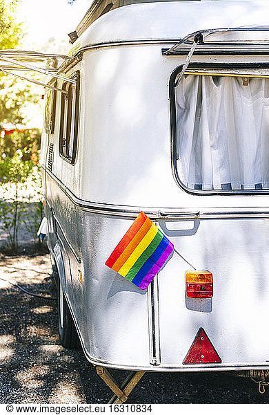 Close-up of rainbow flag in tail light on motor home