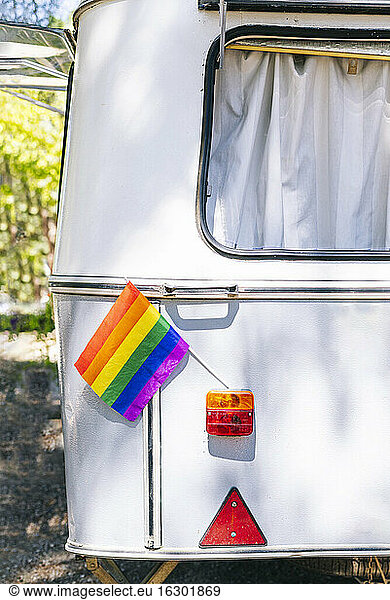 Close-up of rainbow flag on motor home