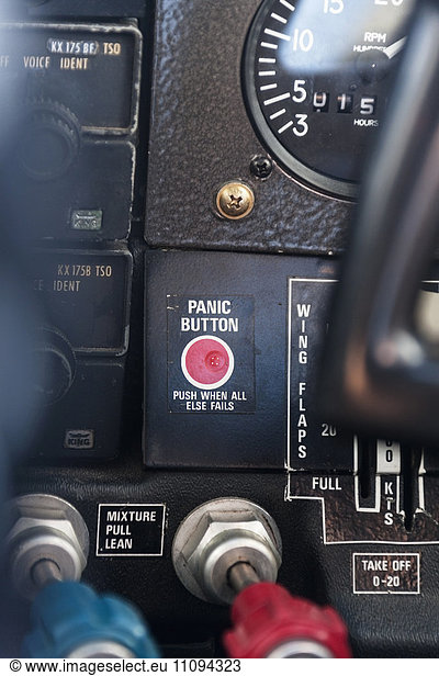 Close-up of red panic button in cockpit  Venezuela