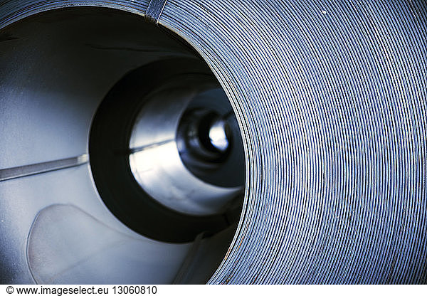 Close-up of rolled up metal sheets in factory