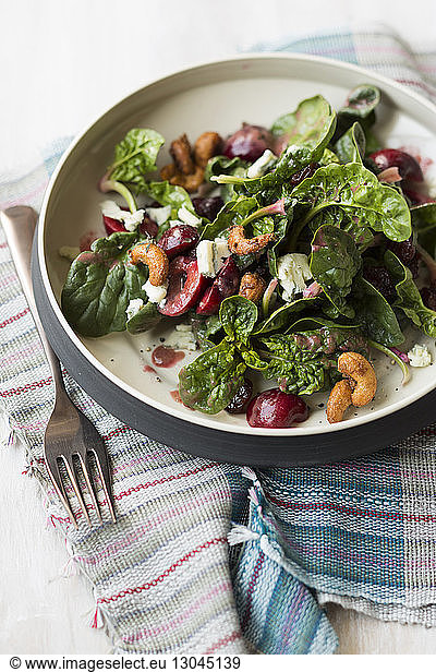 Close-up of salad in bowl on textile