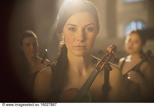 Close up of serious violinist