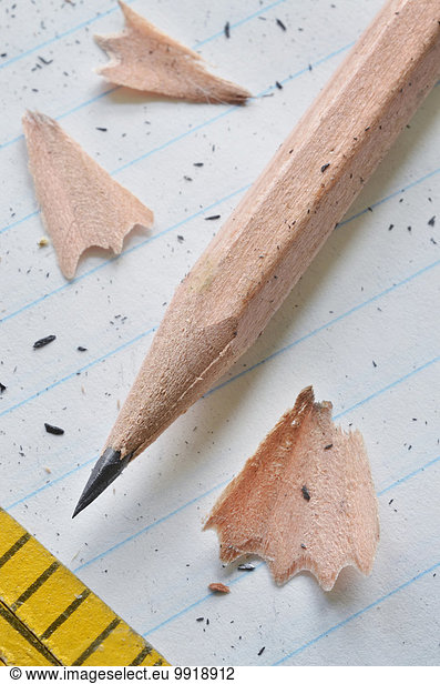 close up of sharpened pencil and wooden ruler
