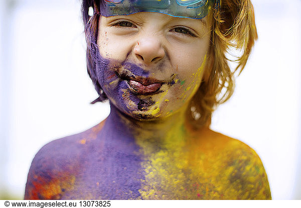 Close-up of shirtless boy with colors