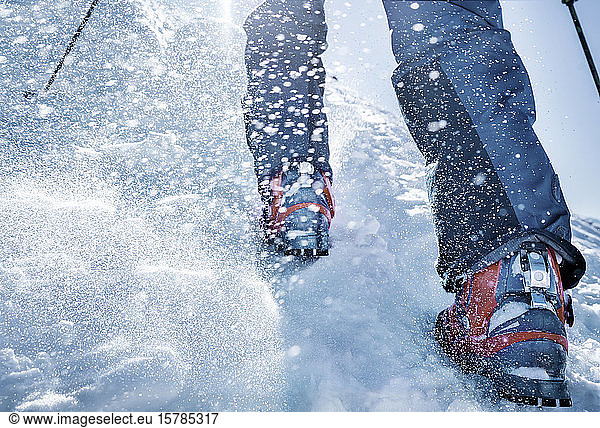 Close-up of ski boots in snow