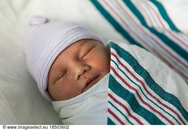 Close up of sleeping newborn baby in hospital