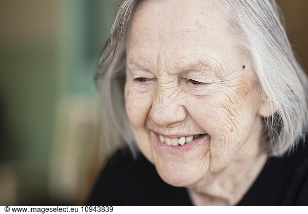 Close-up of smiling senior woman at nursing home