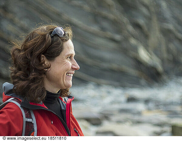 Close-up of smiling woman at the cliff of barrika