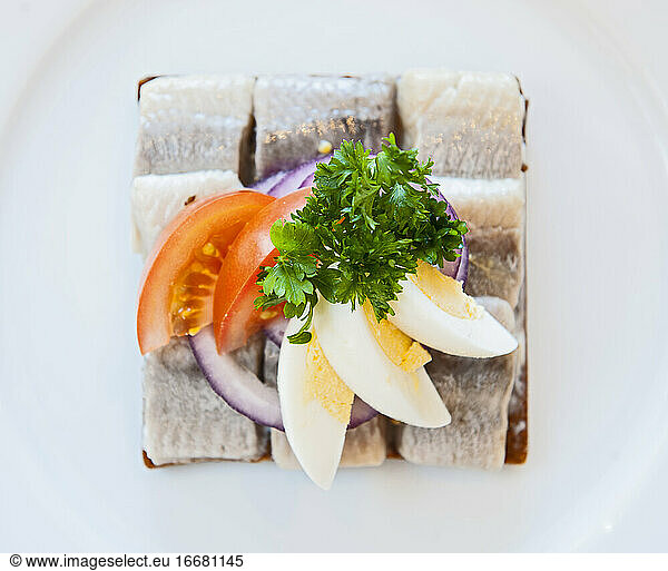 close up of smorrebrod with herring at Icelandic restaurant