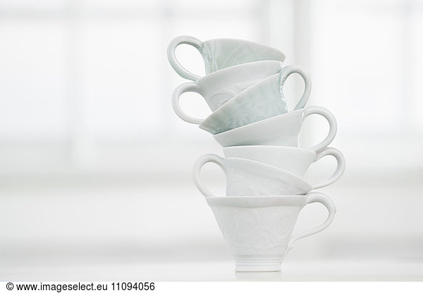 Close-up of stack of white cups  Bavaria  Germany