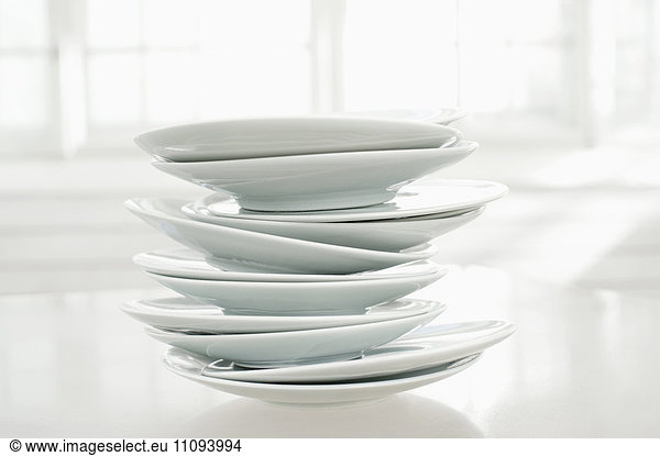Close-up of stack of white plates  Bavaria  Germany