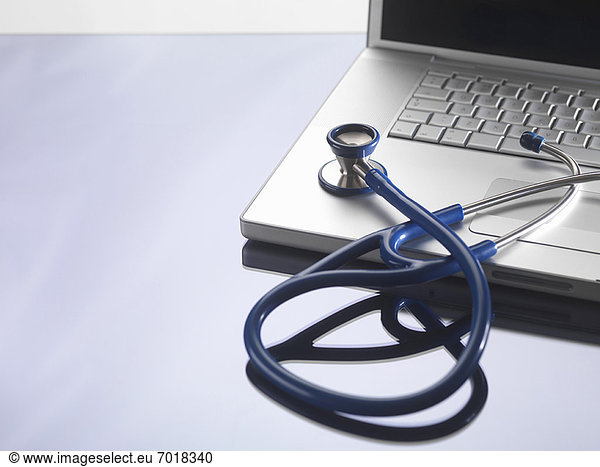 Close up of stethoscope on laptop