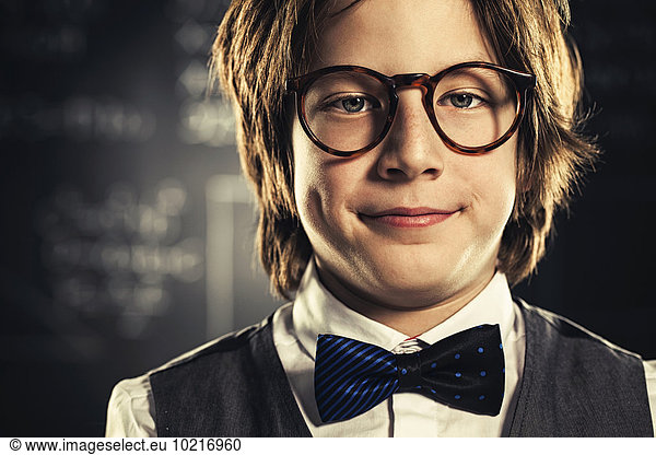 Close up of student wearing bow tie and eyeglasses