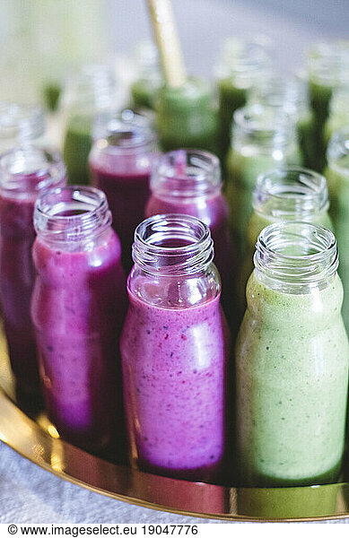 Close up of variety of breakfast smoothie in little vintage bottles