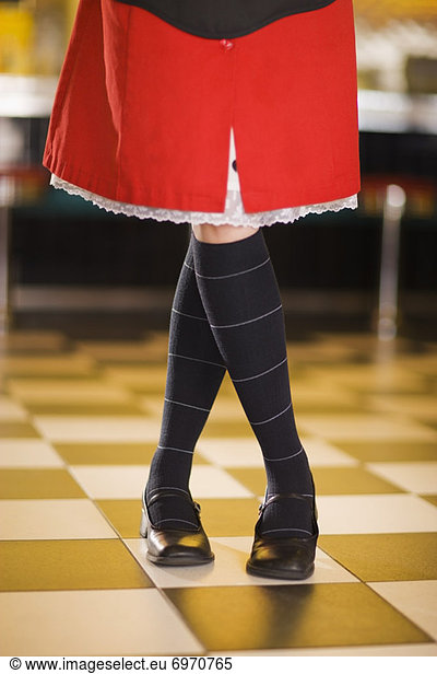 Close-up of Waitresss Legs and Skirt in a Retro Diner