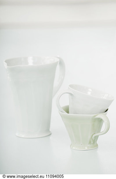 Close-up of white cups and pitcher  Bavaria  Germany