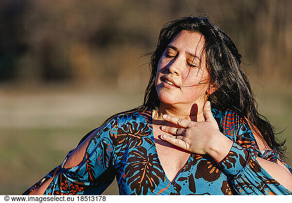 Close-up of woman dancing flamenco with hand to heart