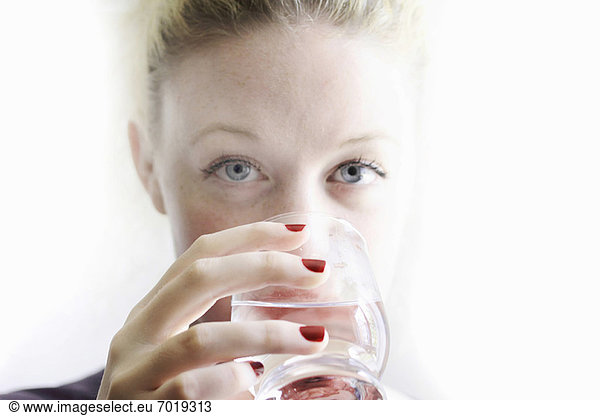 Close up of woman drinking glass of wine