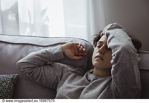 Close-up of woman having headache at home